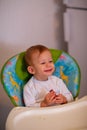 Feeding baby Ã¢â¬â Happy adorable boy eating chocolate Royalty Free Stock Photo